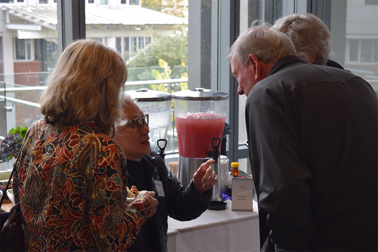 People talking at KEMi's Special Lecture reception