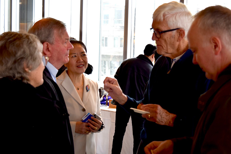 People talking at KEMi's Special Lecture reception