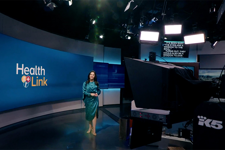 King5 News studio with woman standing in the center