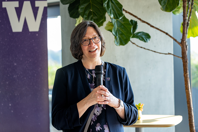 Provost Serio speaking on a microphone